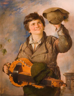 A young person with short hair smiles while holding a rustic, stringed musical instrument in one hand and a green hat in the other. The clothing appears worn and patched, suggesting a historical or rural setting. The background includes a softly painted sky with some foliage visible.
