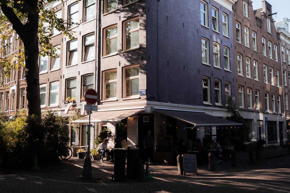 a street corner with a tall building in the background