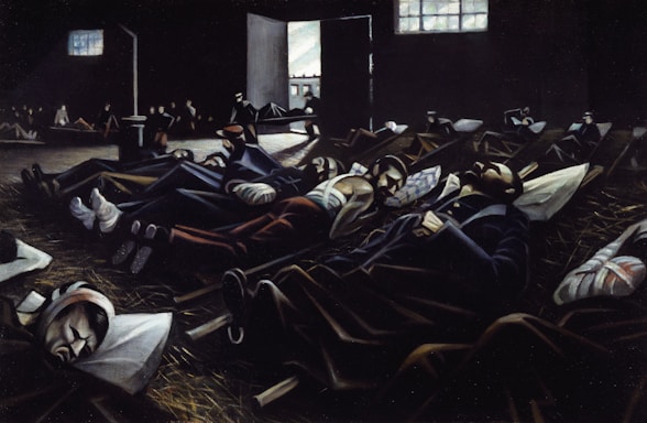 A dimly lit room filled with several people lying on the floor, appearing to be resting or injured. The scene has a somber atmosphere with light streaming in through a window and an open door, illuminating parts of the room.