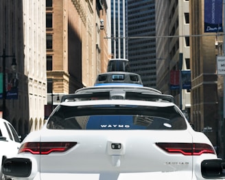 a car that is driving down the street