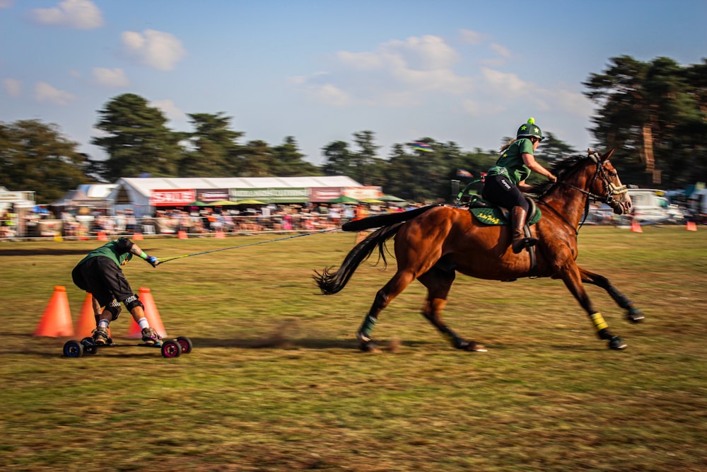 a person riding a horse next to a person on a skateboard