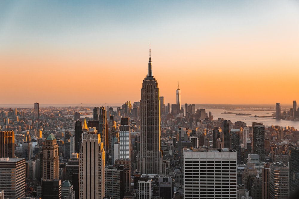 a view of a city skyline at sunset