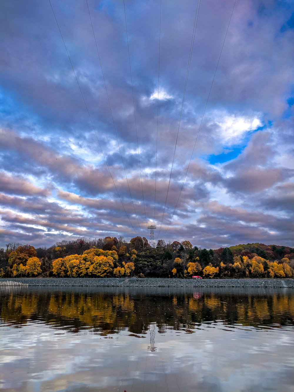 a person flying a kite over a body of water