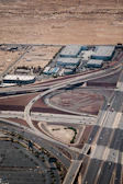 Aerial view of a busy highway with trucks moving goods across Morocco’s landscape.