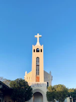 The Fepau church building standing proudly against a clear blue African sky.