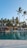 A happy guest enjoying the villa's private pool.