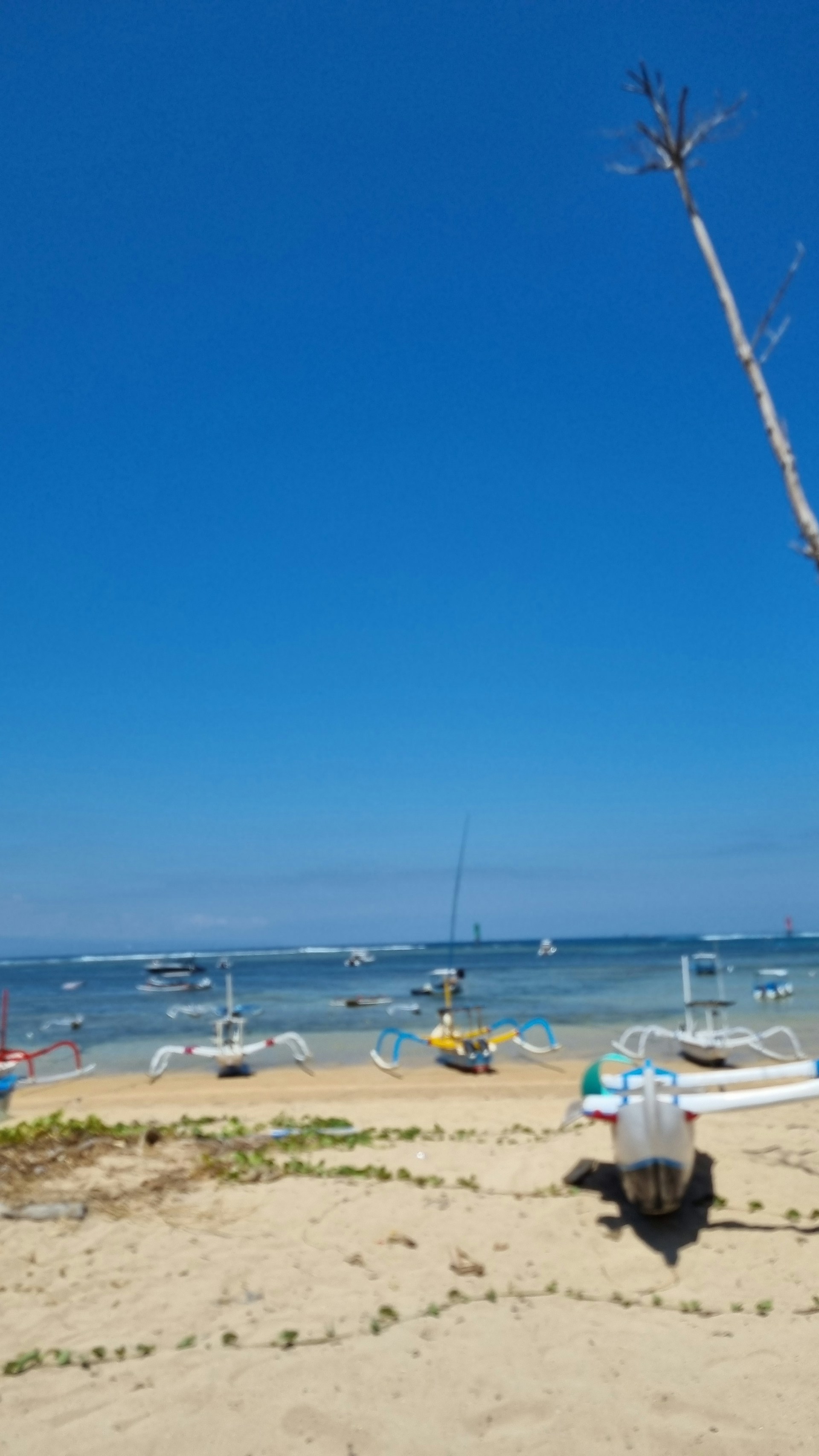 woman wearing yellow long-sleeved dress under white clouds and blue sky during daytime