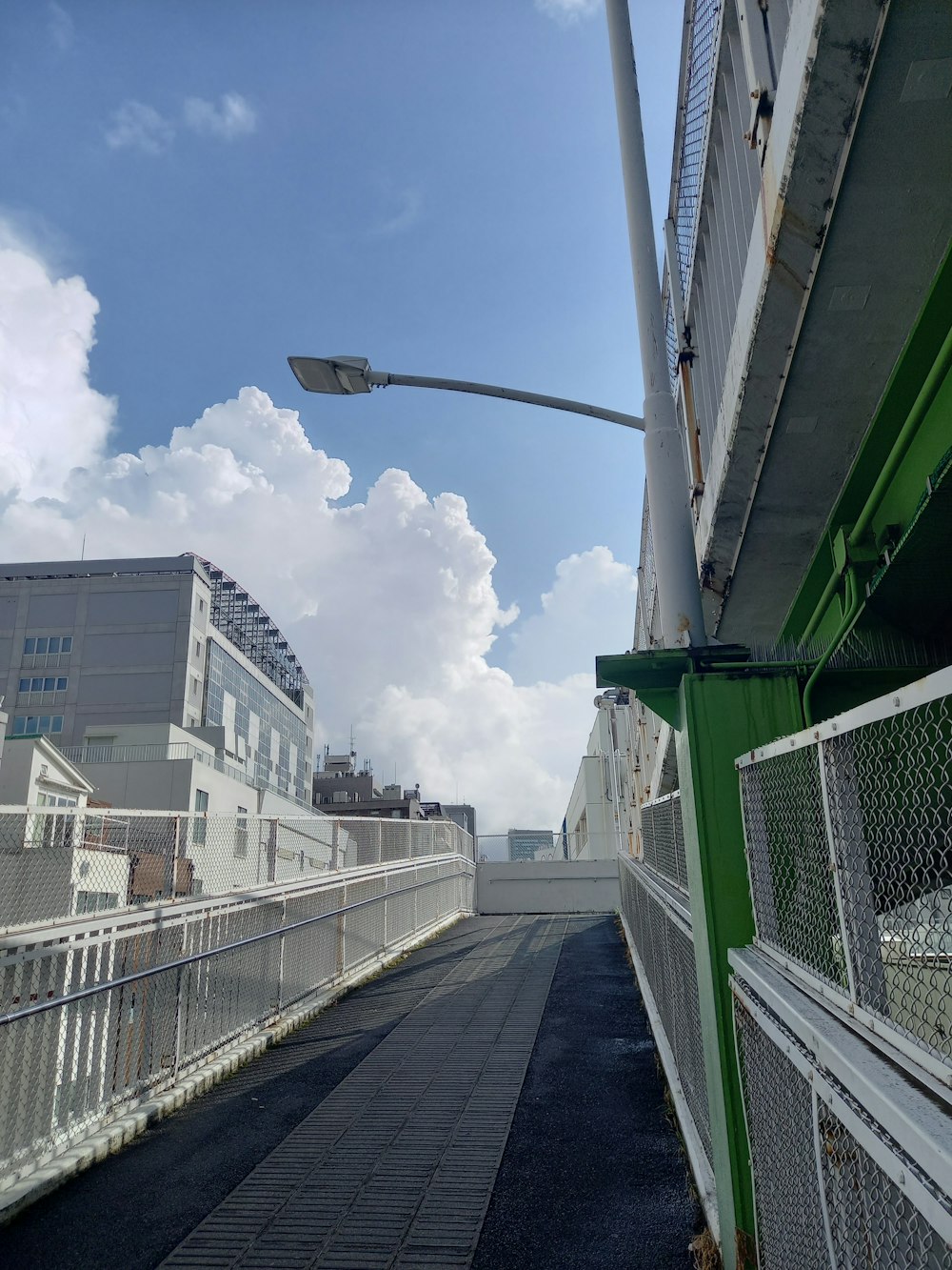 a street light on a metal pole next to a building