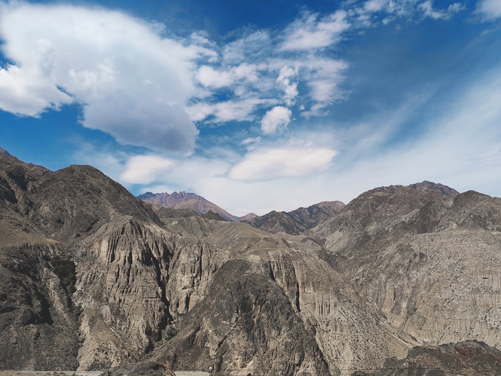 a mountain range with a body of water in the foreground