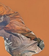 Close-up of a rugged earth-toned custom printed t-shirt with a bold design.