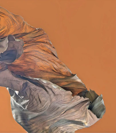Close-up of layered abstract terrain textures blending terracotta and muted gold tones on a deep black background.