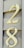 Cream-colored numbers, 2 and 8, are mounted with screws on a beige, wood-textured background, likely representing house siding.