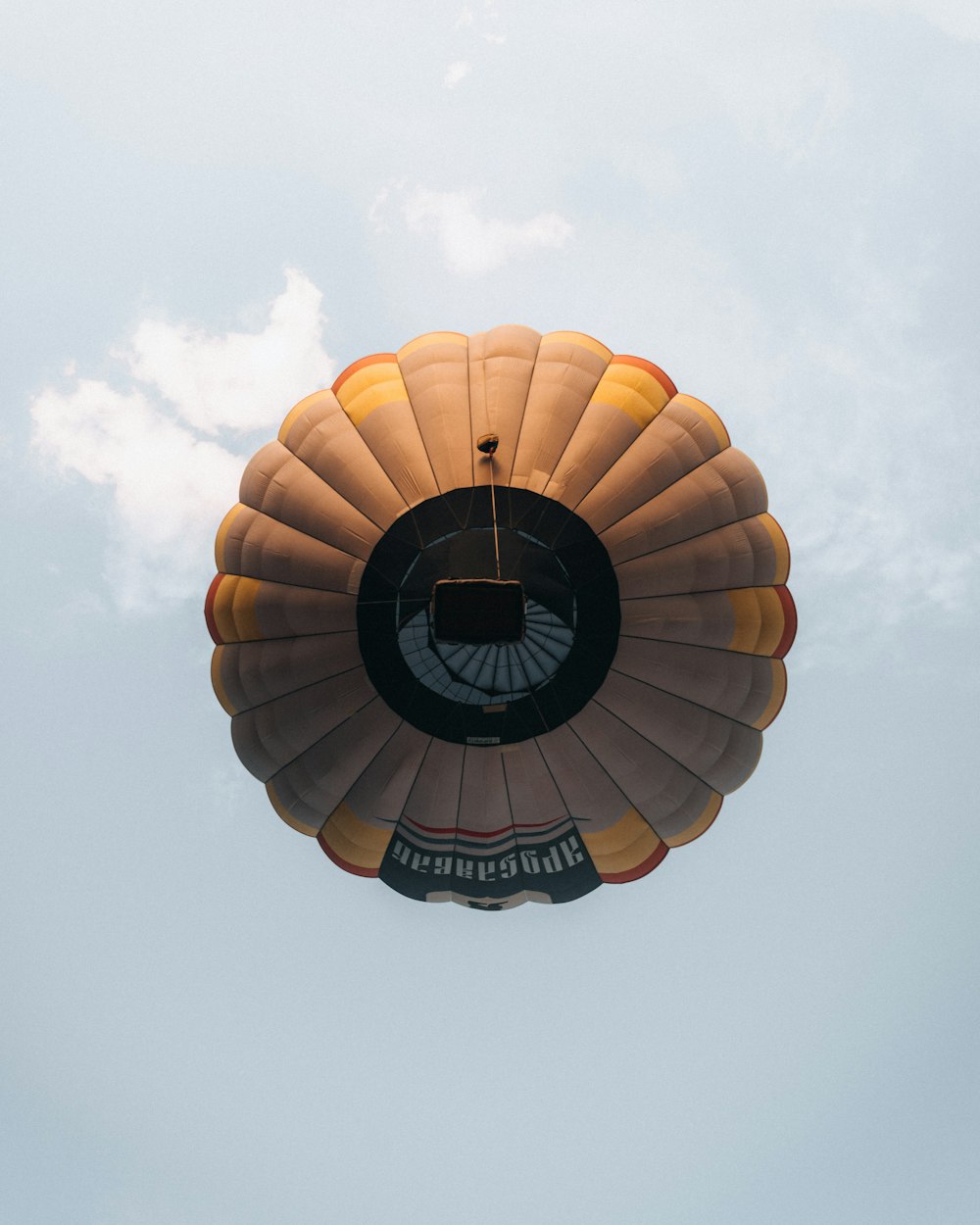 a couple of hot air balloons flying in the sky