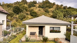 a small house with a small garden in front of it