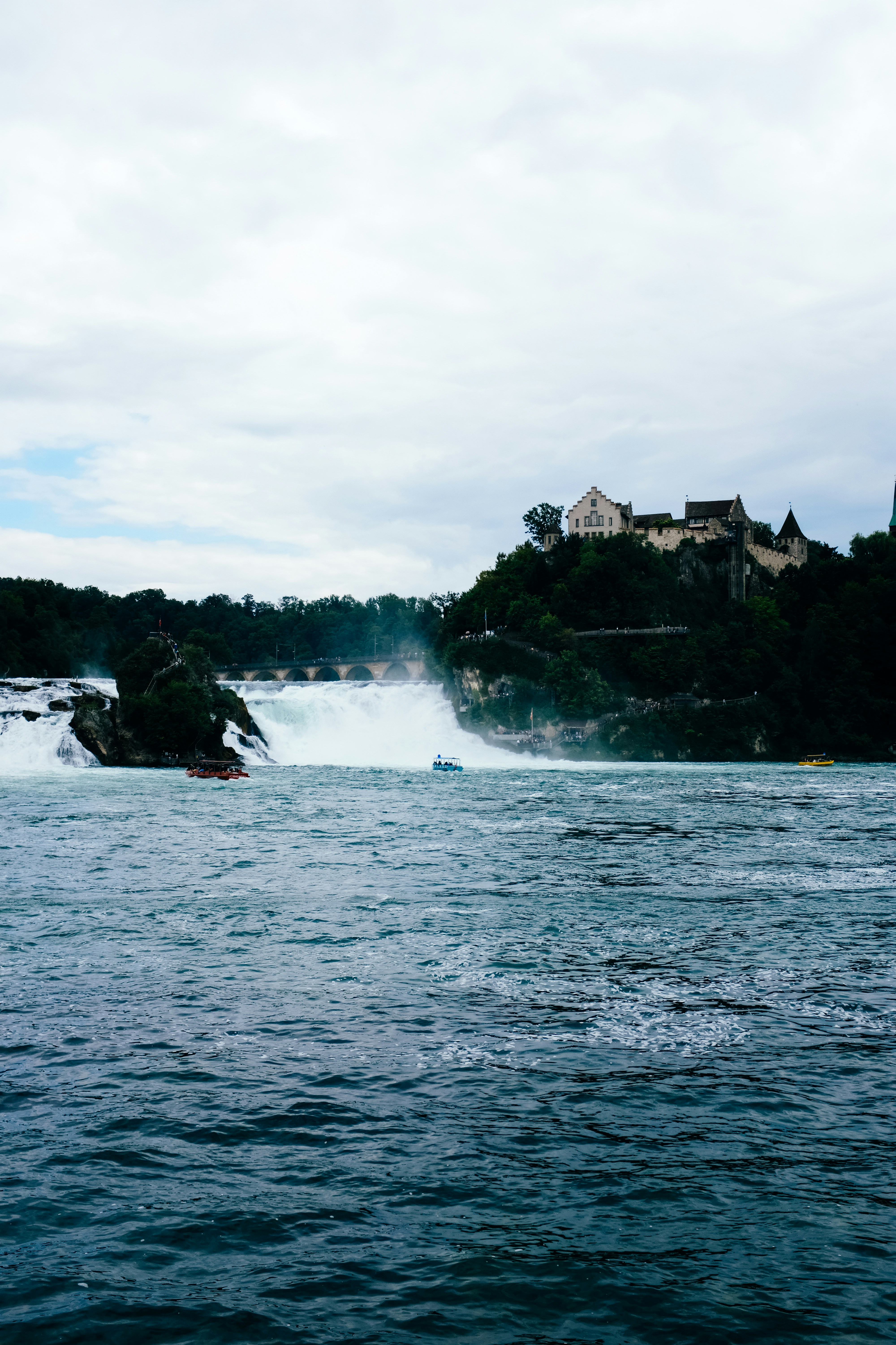 a large body of water with a castle in the background