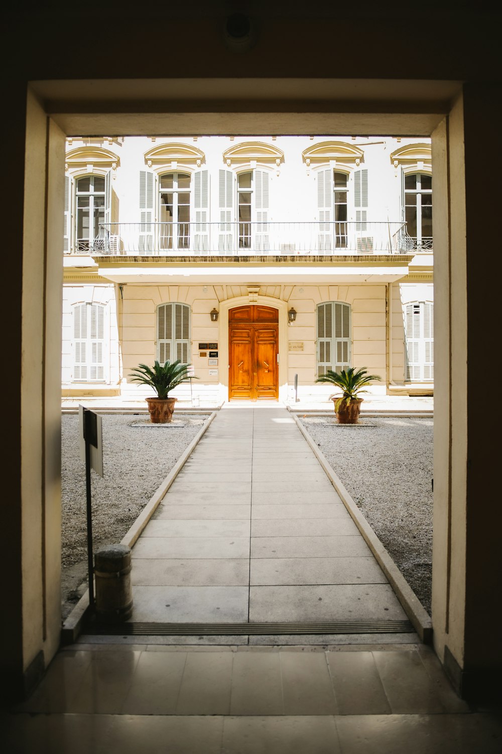an open door leading to a large building