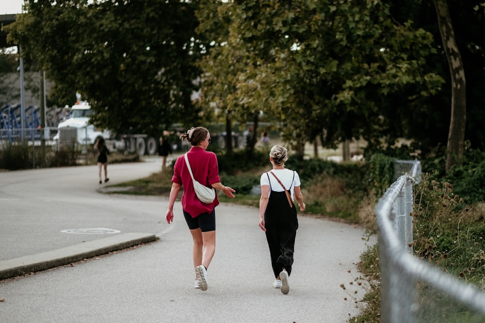a couple of women walking down a street