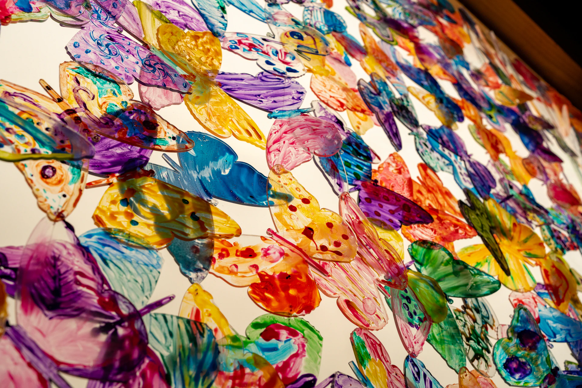 A vibrant butterfly-themed painting bursting with color and delicate wing patterns, capturing the spirit of bfly art.