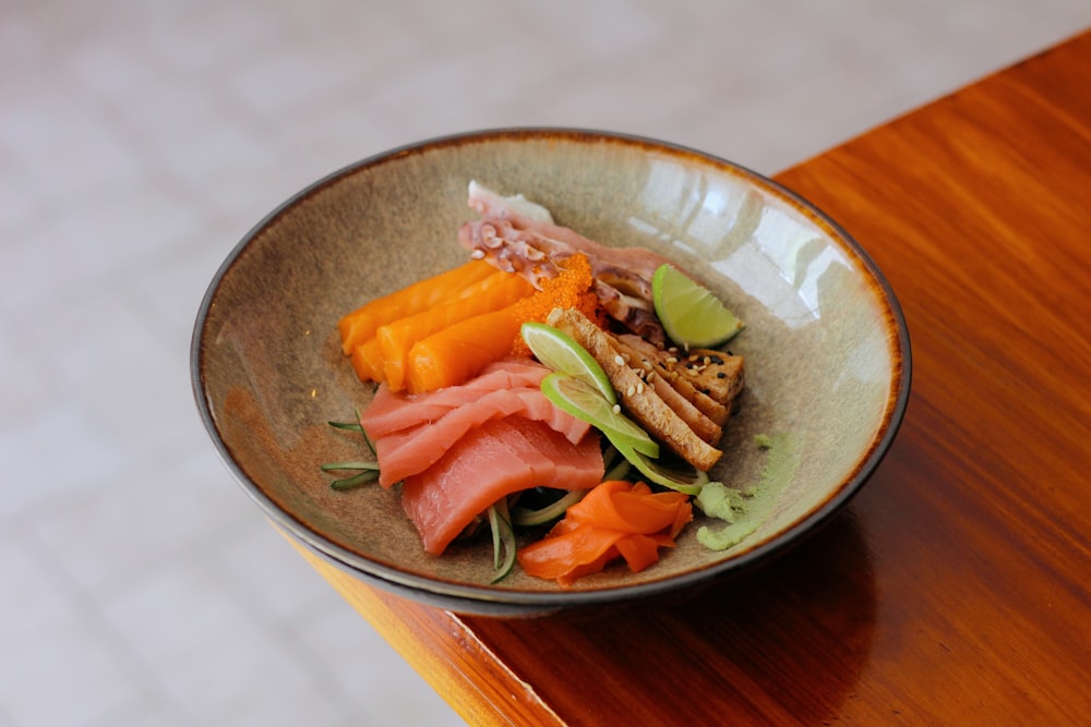 a bowl of food on a wooden table