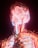A vibrant and intricate visualization of a human form composed of neon-like light strands. The colors predominantly consist of reds, blues, and warm hues, creating an electrifying and dynamic effect. The structure resembles the nervous system, with a focus on the head and upper torso.