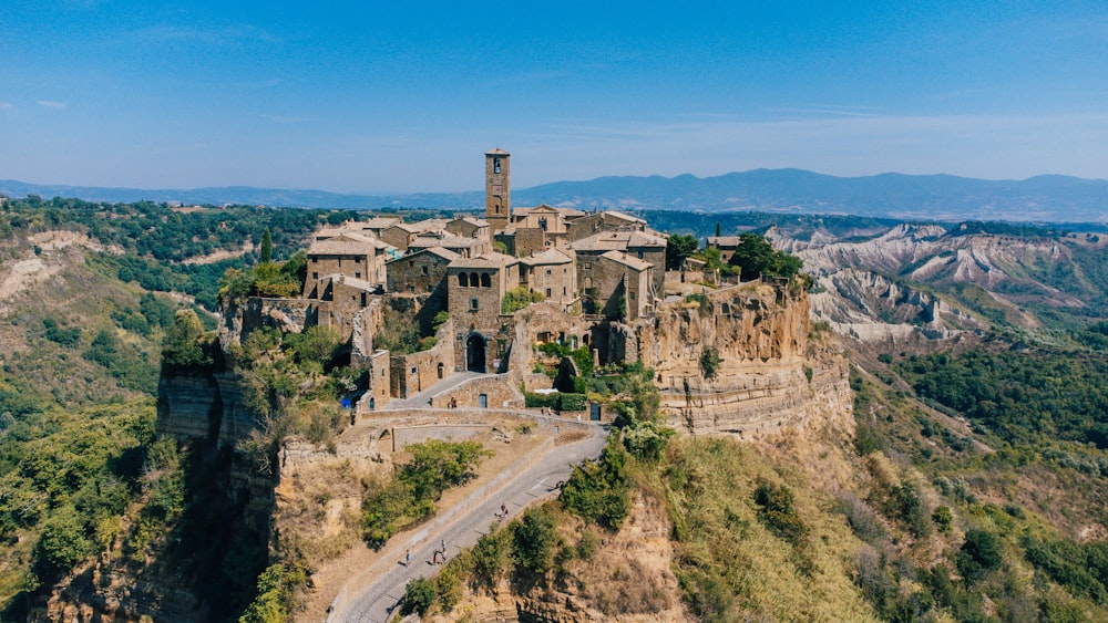 an old castle perched on top of a mountain