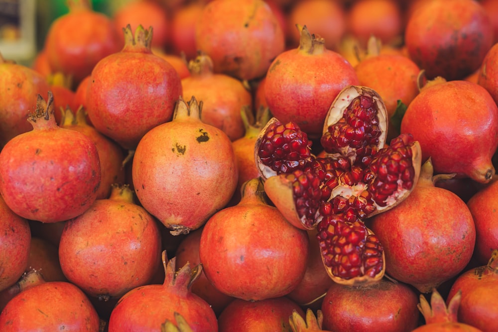 a pile of pomegranates sitting on top of each other