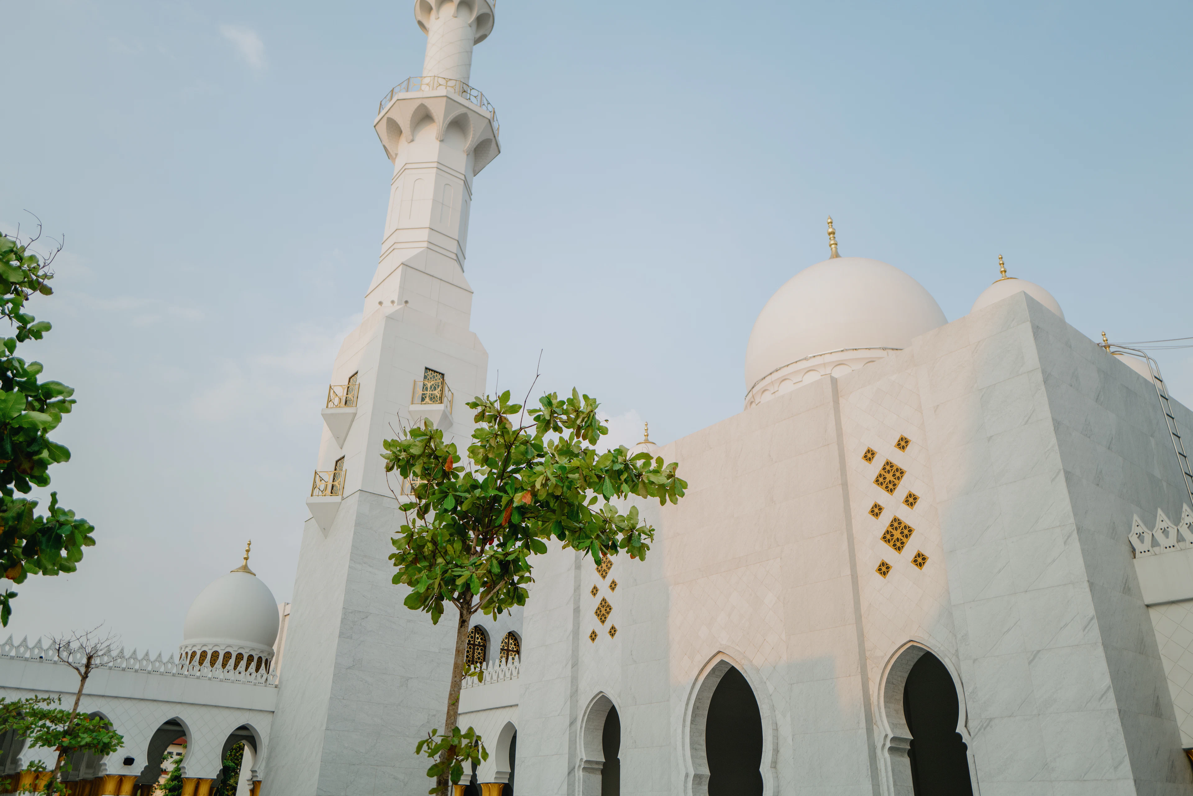 A large white building with a tall white tower