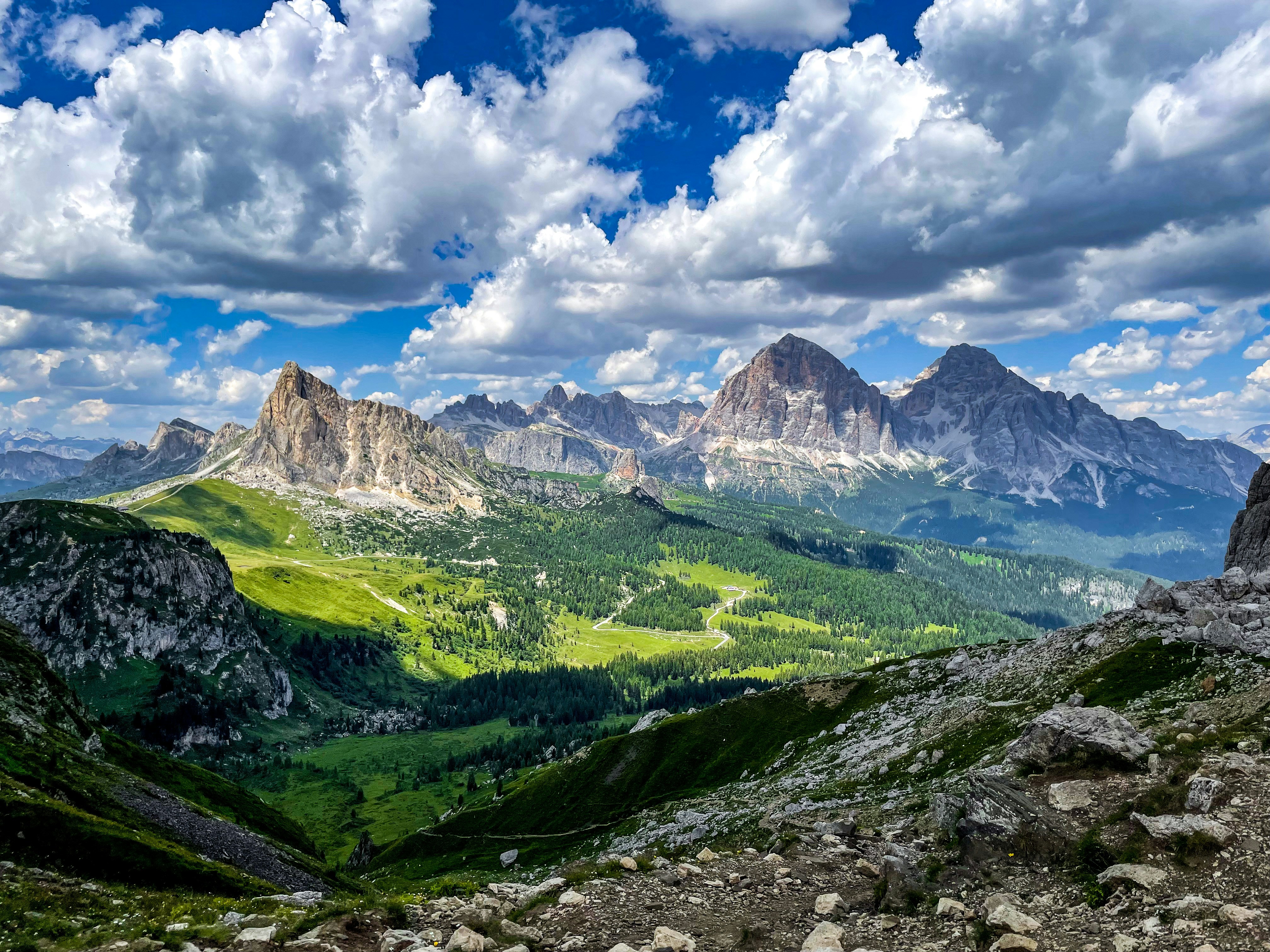 a scenic view of mountains and valleys under a cloudy sky