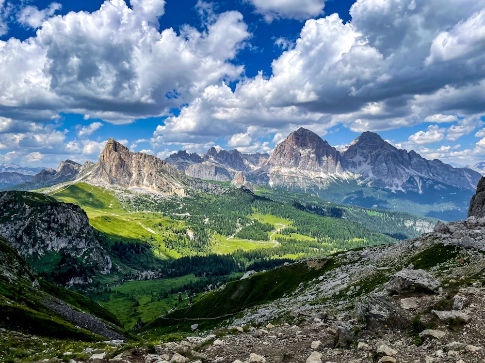 a scenic view of mountains and valleys under a cloudy sky