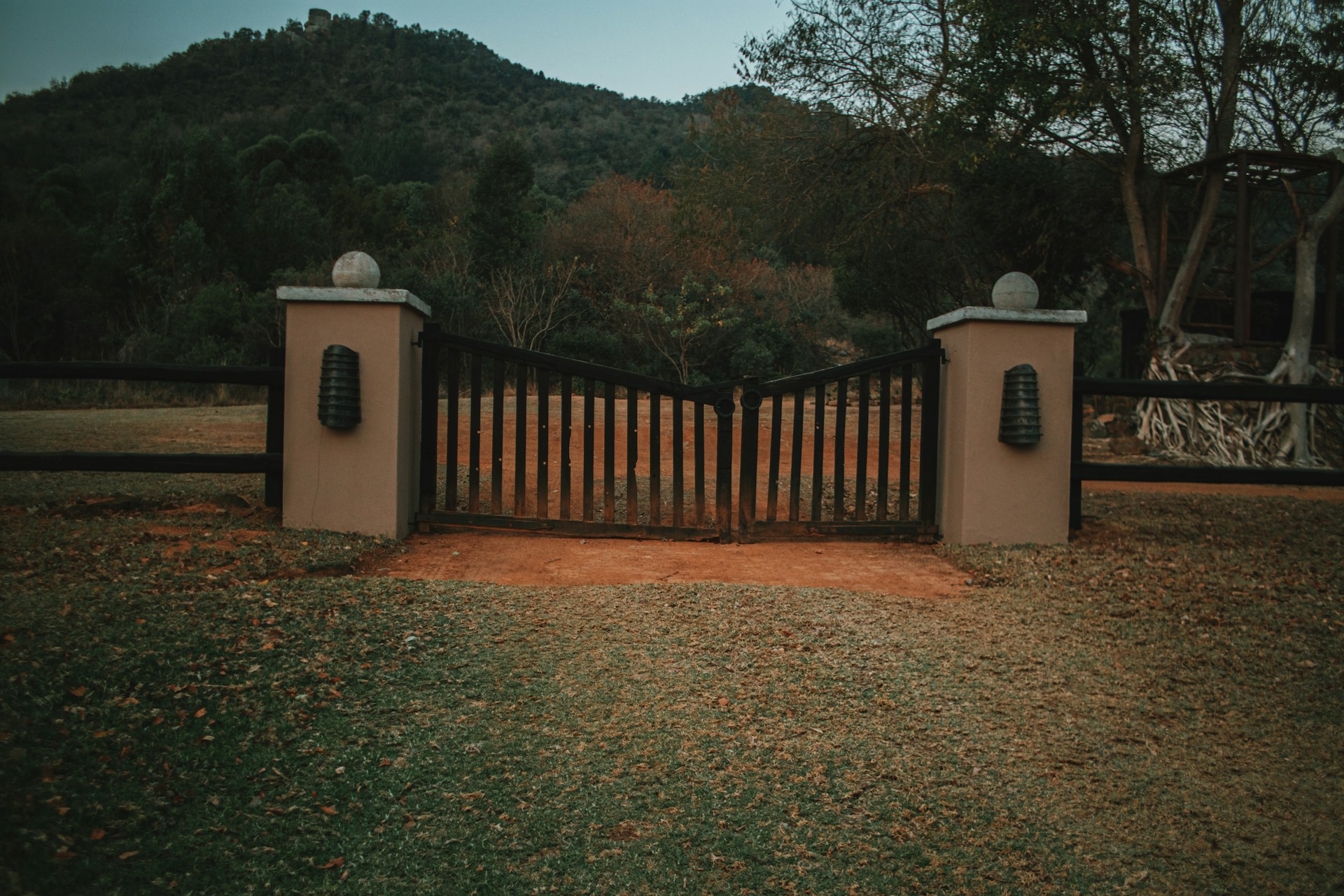 a gate with two telephones on top of it