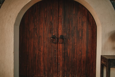 a large wooden door in a stone building