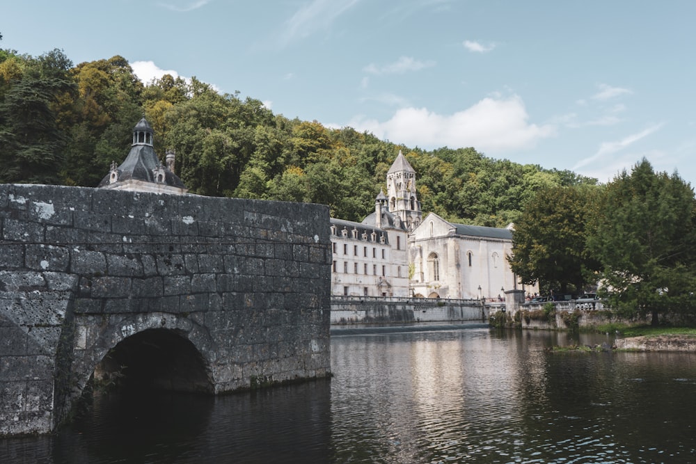 a large building sitting on the side of a river