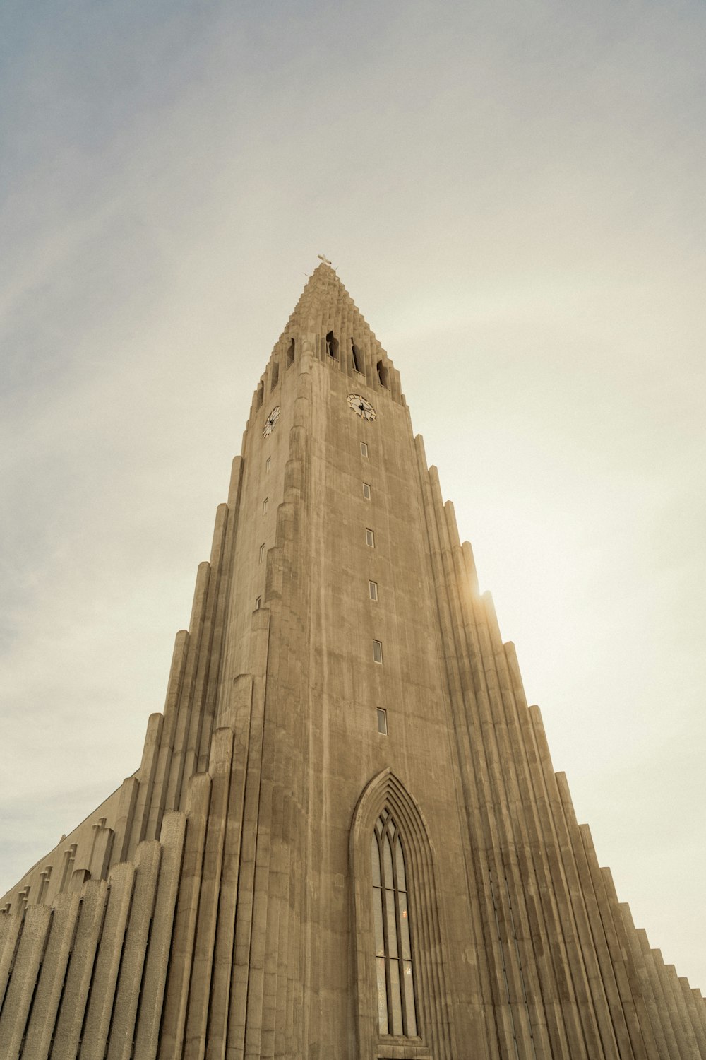 a very tall building with a clock on it's side