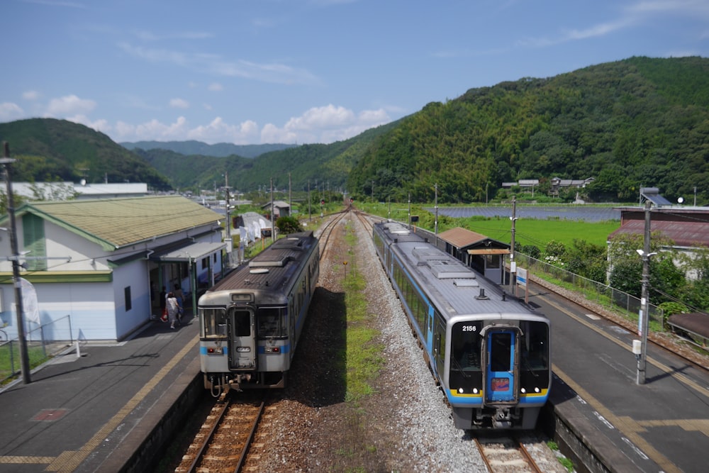 a couple of trains that are sitting on the tracks