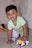 A happy child playing with toys from Apna Dukan.