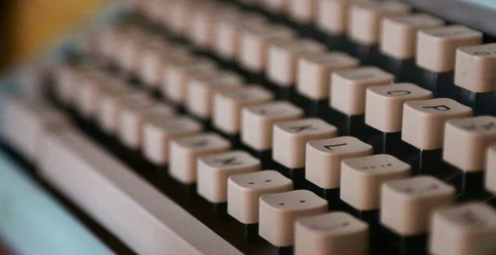 a close up of a computer keyboard with a blurry background