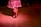 Close-up of dancers' feet moving rhythmically on a wooden stage floor.