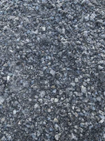 Close-up of rich, earthy pea gravel piles ready for delivery.