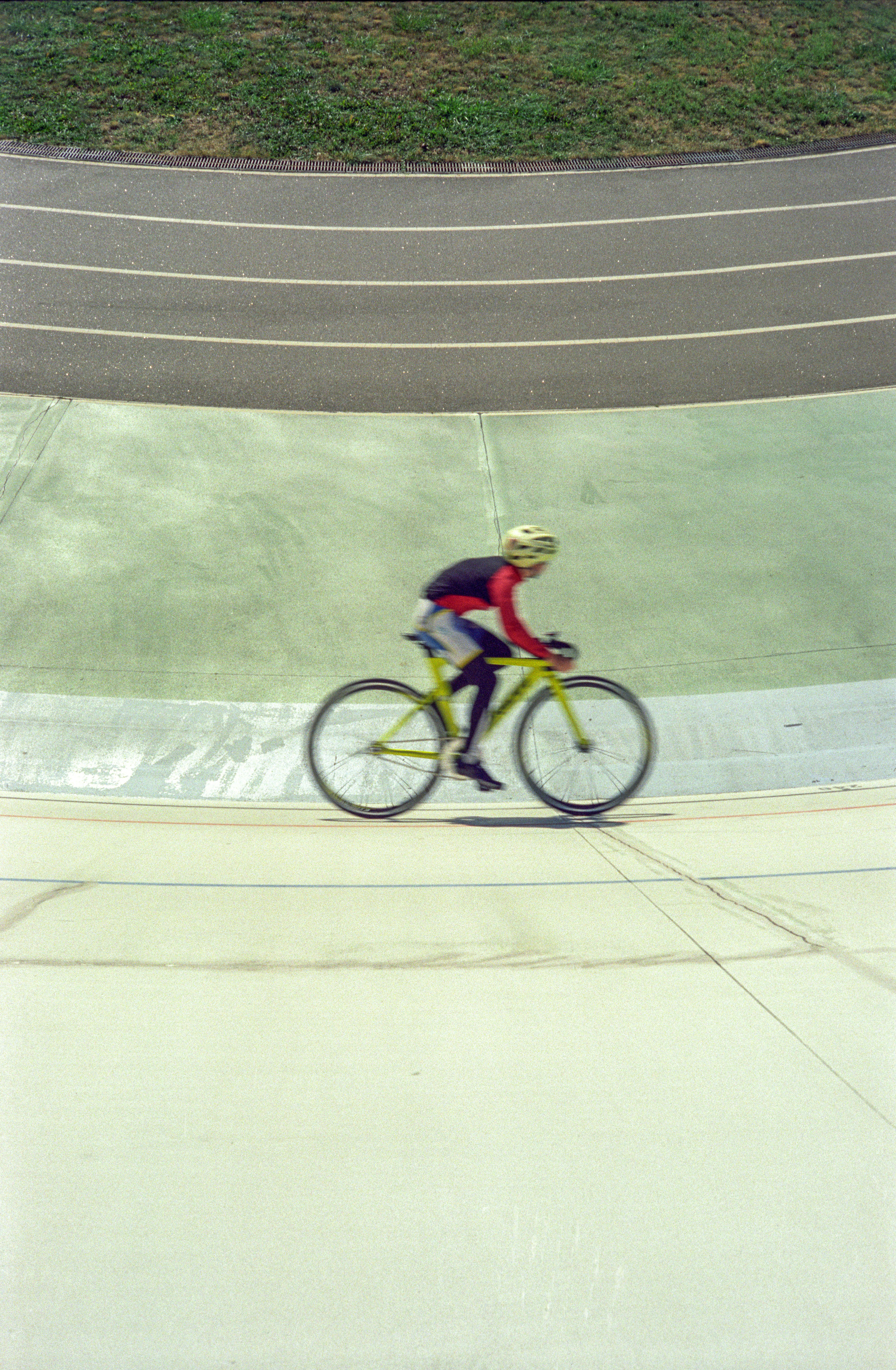 a man riding a bike down a street