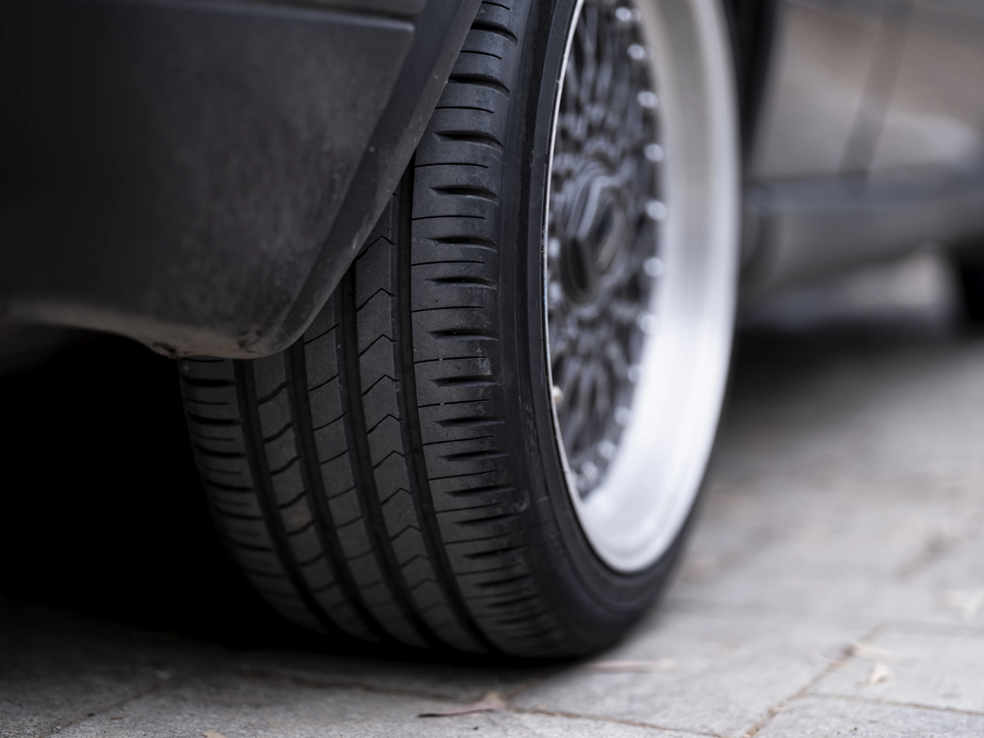 Close-up of a tire and wheel on a car
