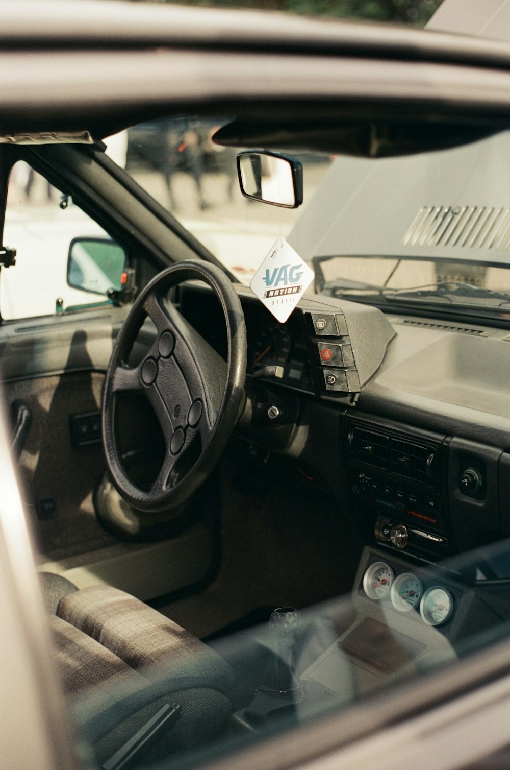 a car with a steering wheel and dashboard