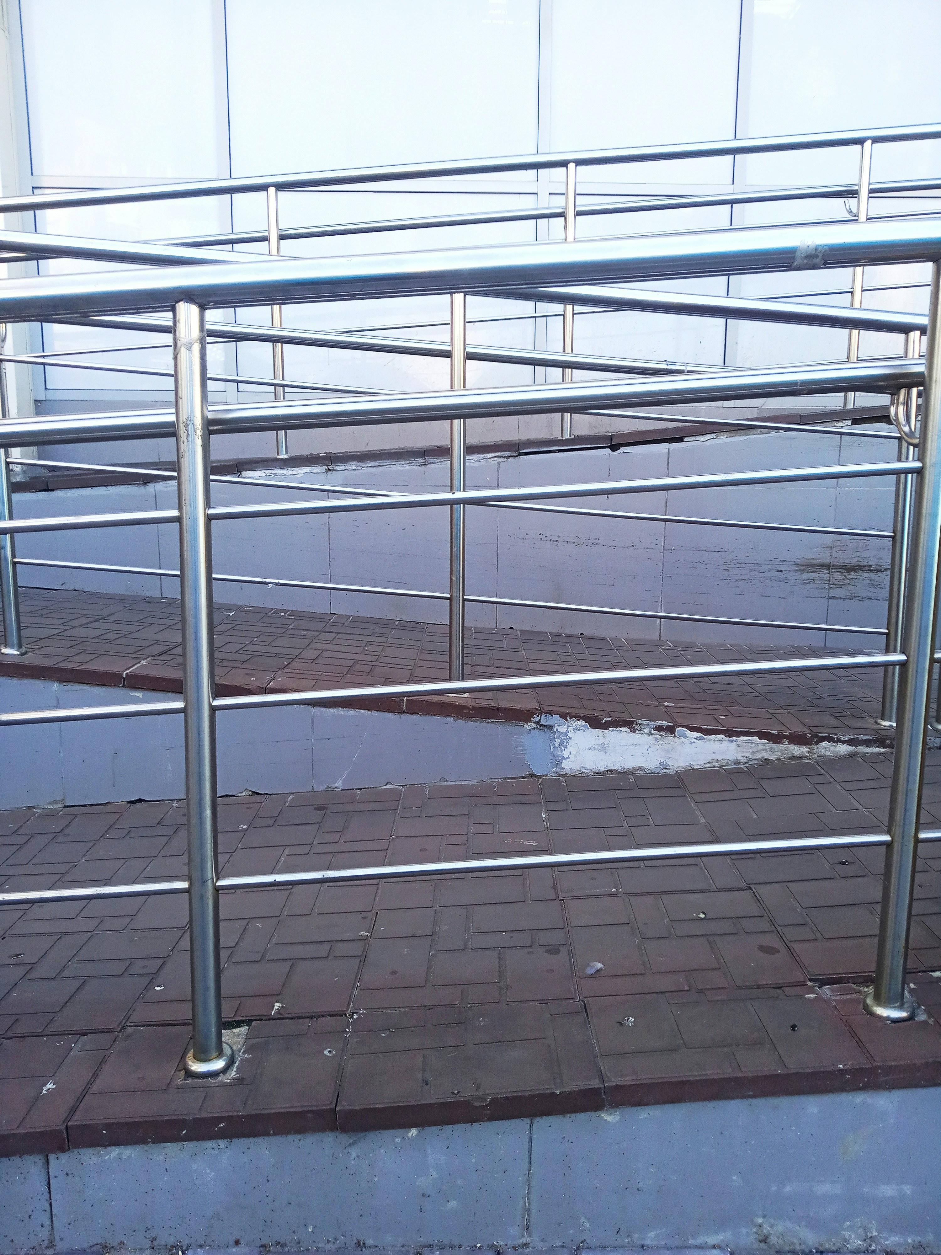 Aluminum ramp in use outside a public building