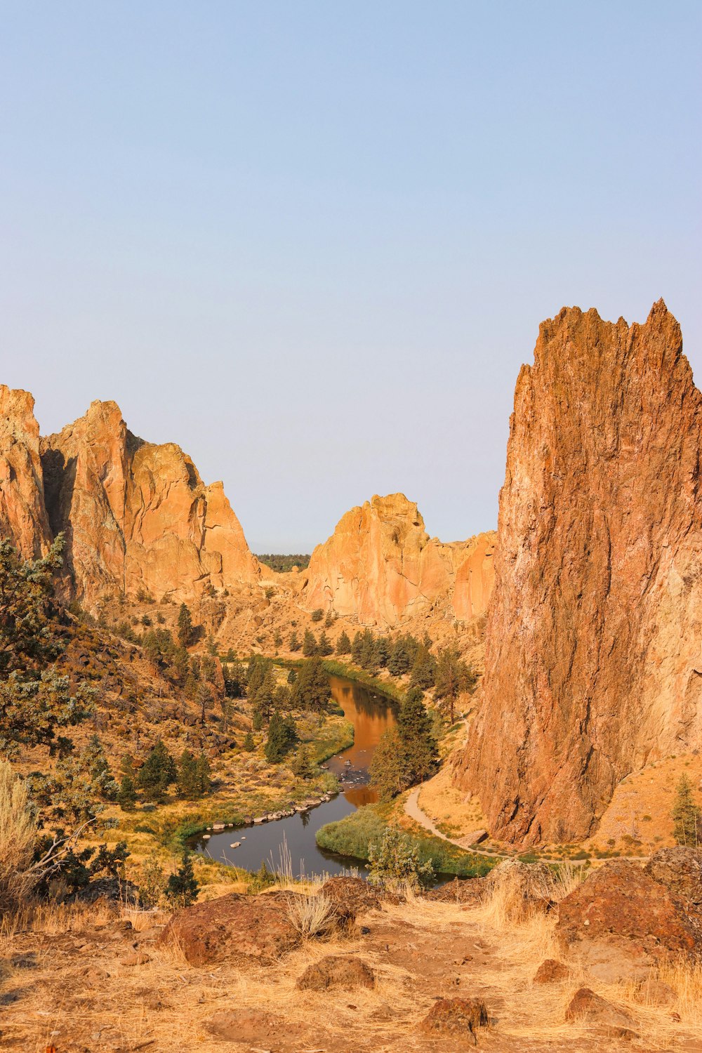 a rocky landscape with a river in the middle