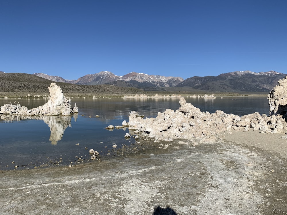 a body of water surrounded by mountains and rocks