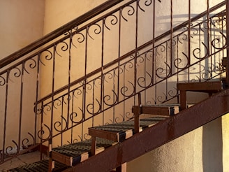 A beautiful staircase with steel railings.