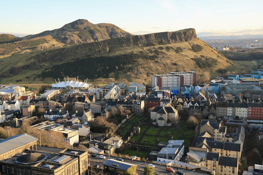 a view of a city with mountains in the background