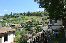 A scenic view of a charming Andalusian village with whitewashed houses and rolling hills.