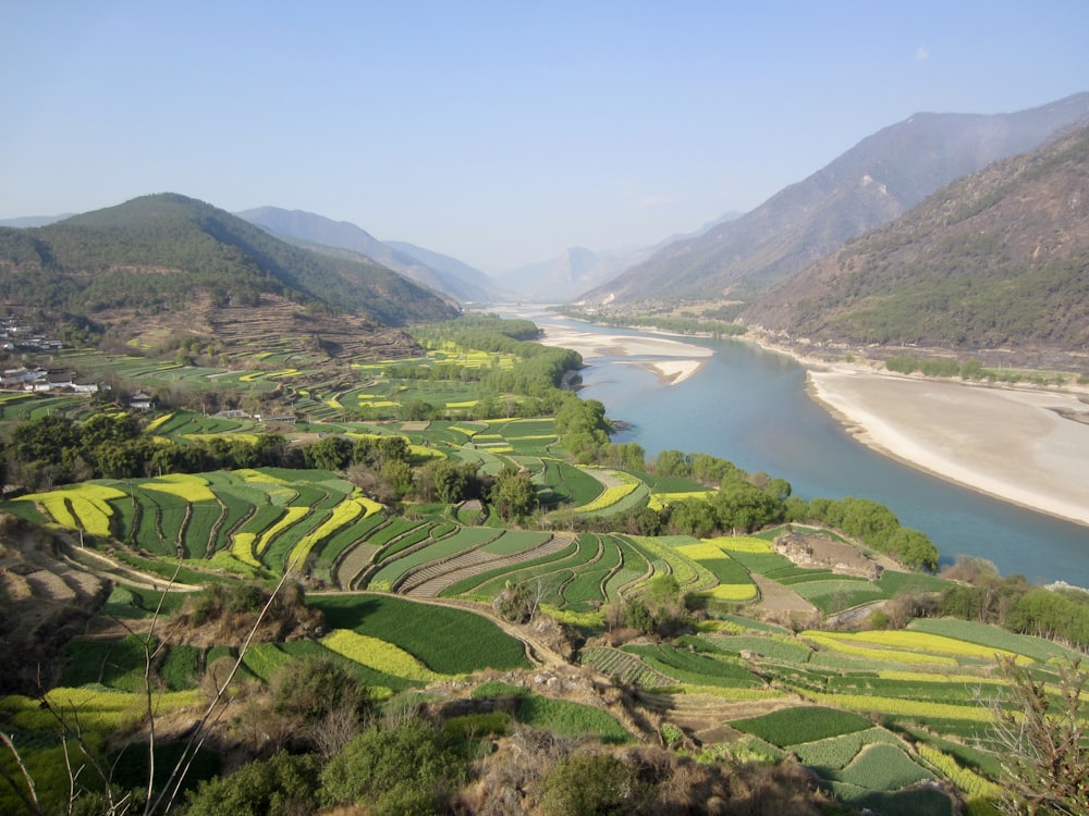 a river running through a lush green valley