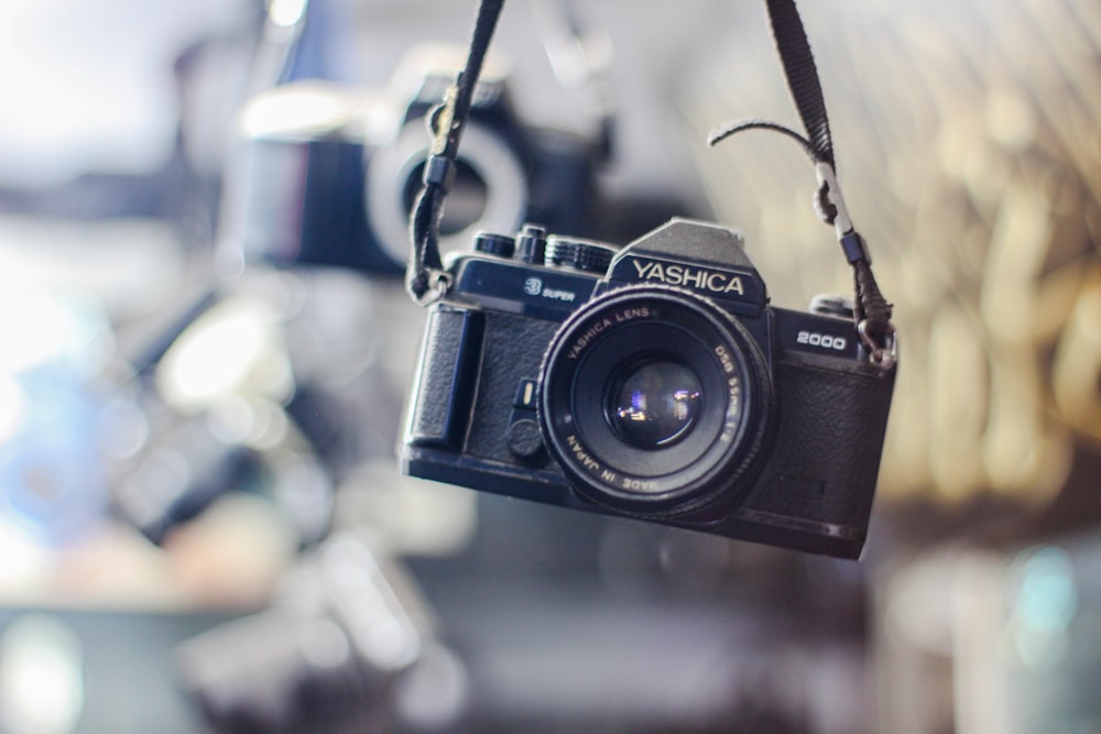 a camera hanging from a hook in a room