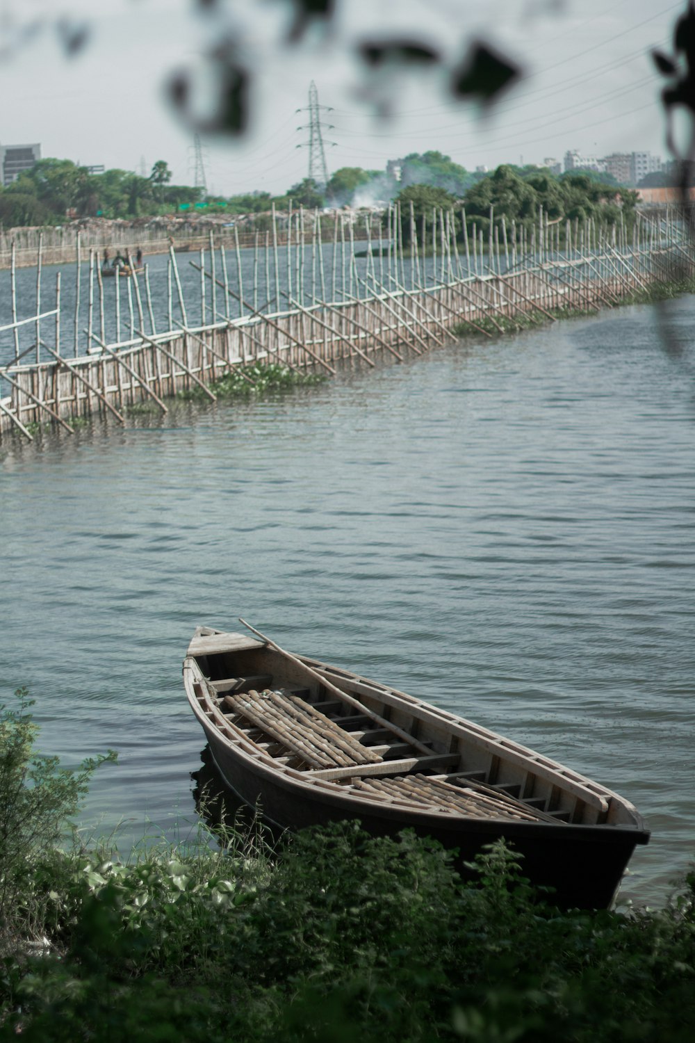 a small boat sitting on top of a body of water